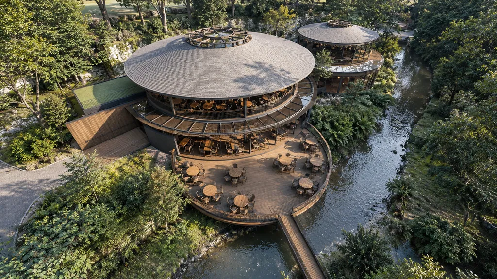 Enchanting Valley, Bogor: a round timber pavilion and deck beside the river in the forest